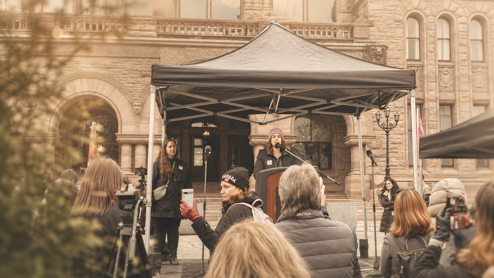 Shannon McNally speaking at an advocacy event at Queen's Park